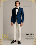 Man wearing a blue suit with white pants and black bow tie on a gray background, featuring the brand 'P&H by Priyanshu'.