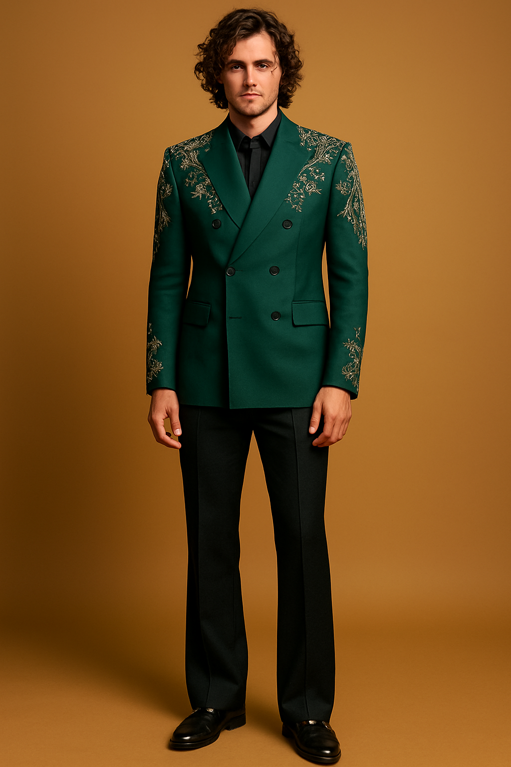 Man wearing a green embroidered suit jacket on a brown background