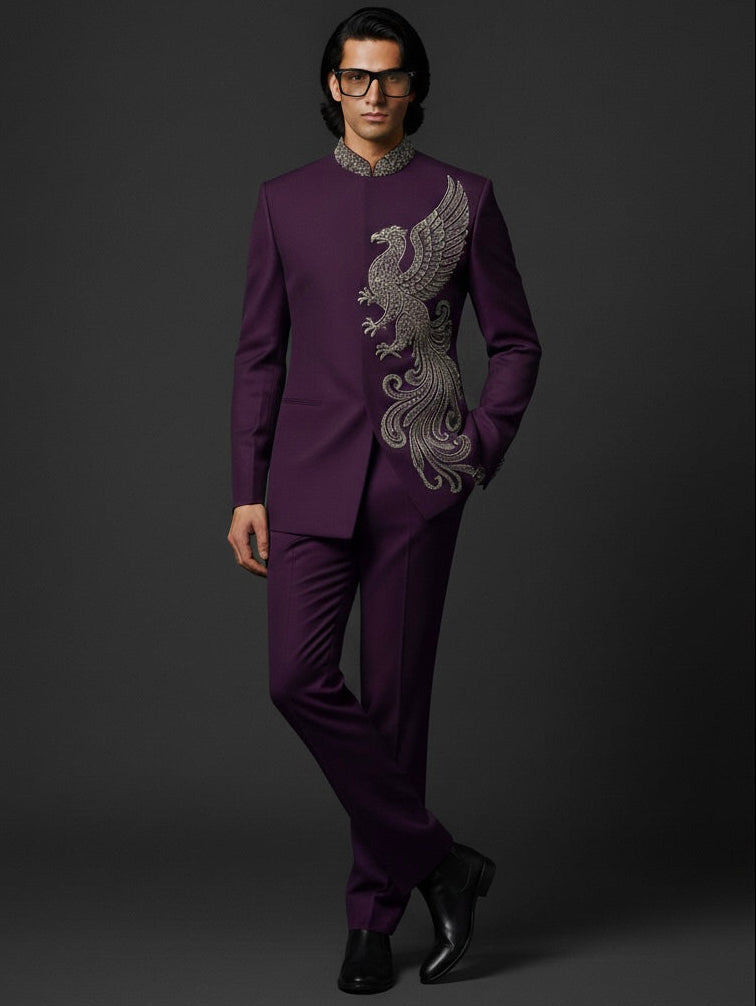 Man wearing a purple suit with intricate silver embroidery on a dark background