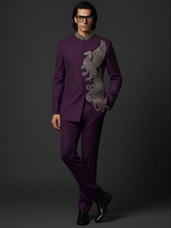Man wearing a purple suit with intricate silver embroidery on a dark background