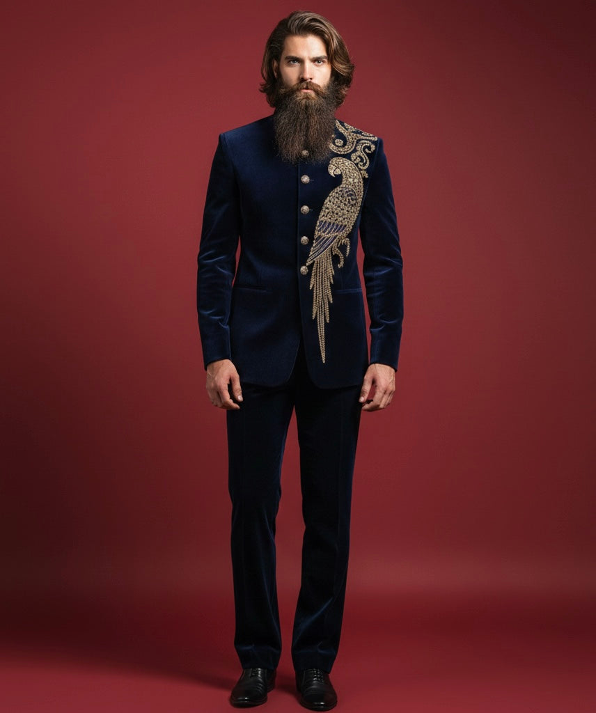 Man wearing a dark blue suit with decorative elements on a red background