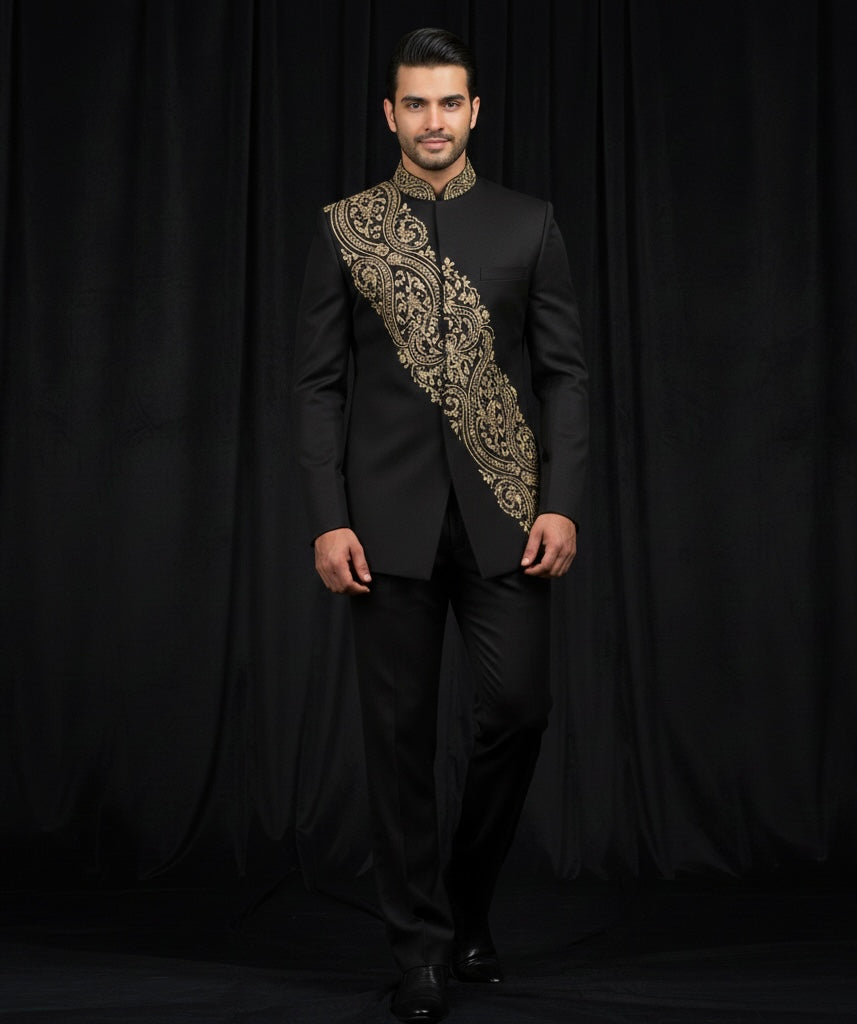Man wearing a black suit with gold embroidery against a black background