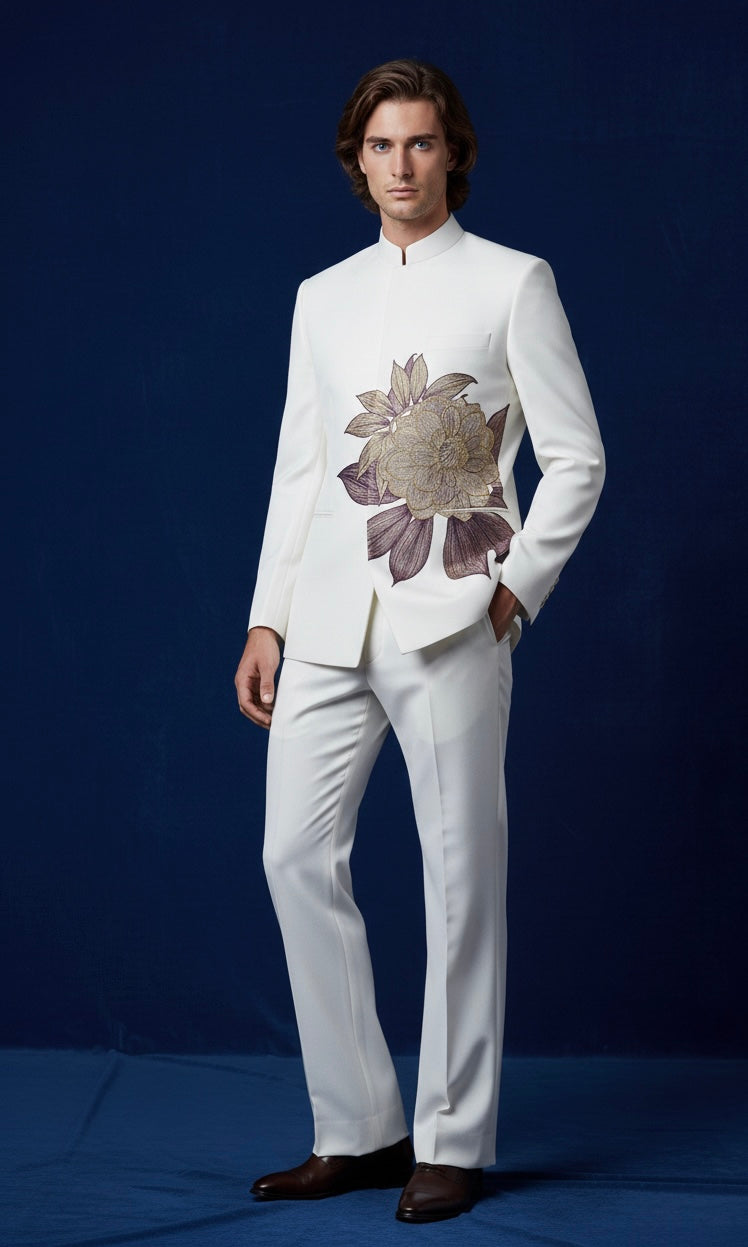 Man wearing a white suit with floral details on a blue background