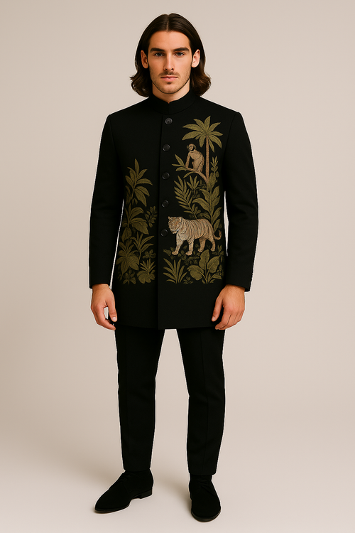 Man wearing a black embroidered jacket with jungle-themed design on a beige background