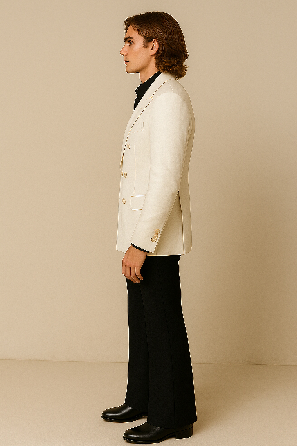 Man wearing a white blazer and black pants against a beige background